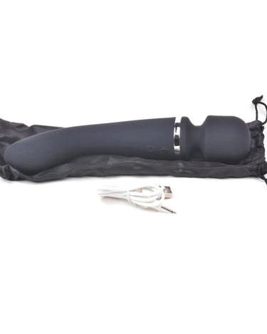 a pair of scissors laying on top of a black bag